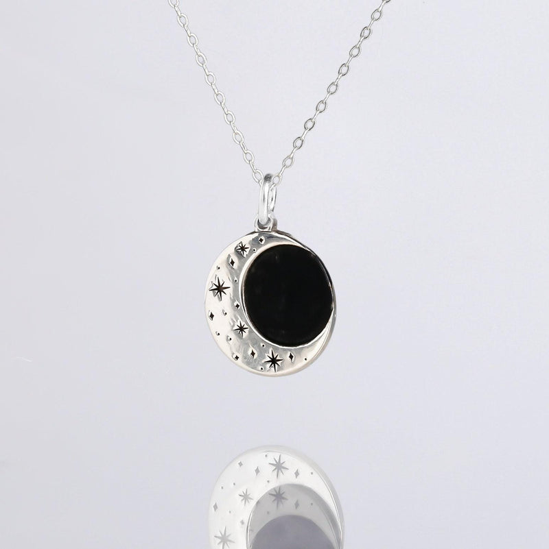 Round gold eclipse pendant with a bright outer ring on a fine chain (3 of 10)