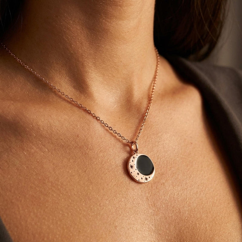 Round gold eclipse pendant with a bright outer ring on a fine chain (8 of 10)