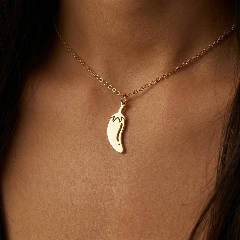 Fine gold necklace with a small curved chili pepper pendant (2 of 12)