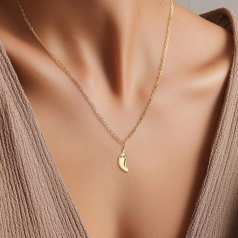 Fine gold necklace with a small curved chili pepper pendant (3 of 12)