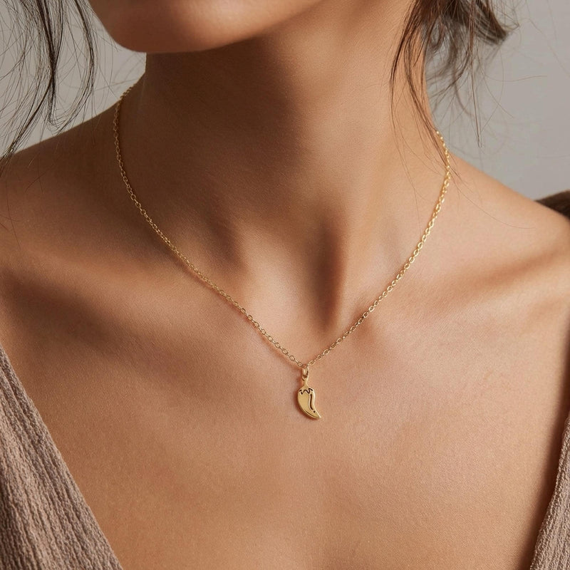 Fine gold necklace with a small curved chili pepper pendant (6 of 12)