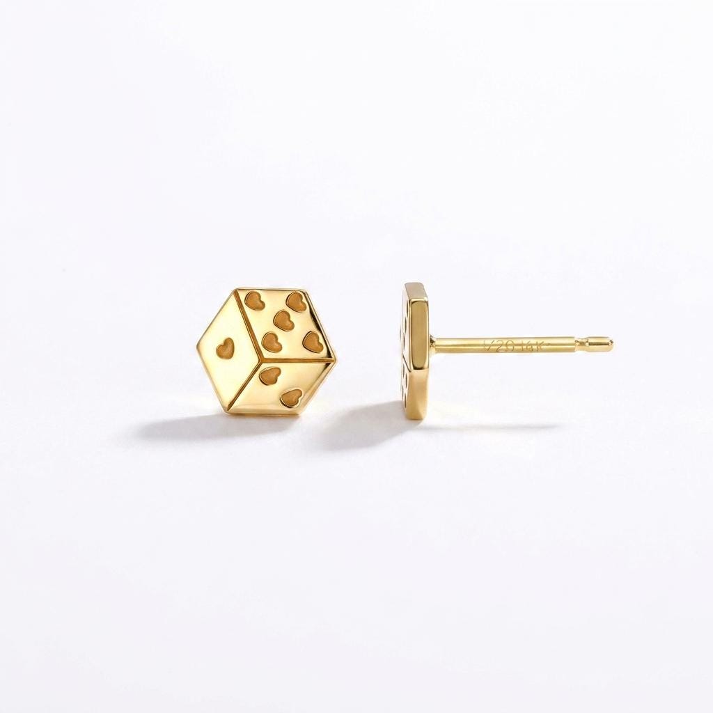 Pair of tiny gold dice stud earrings with heart shaped pips