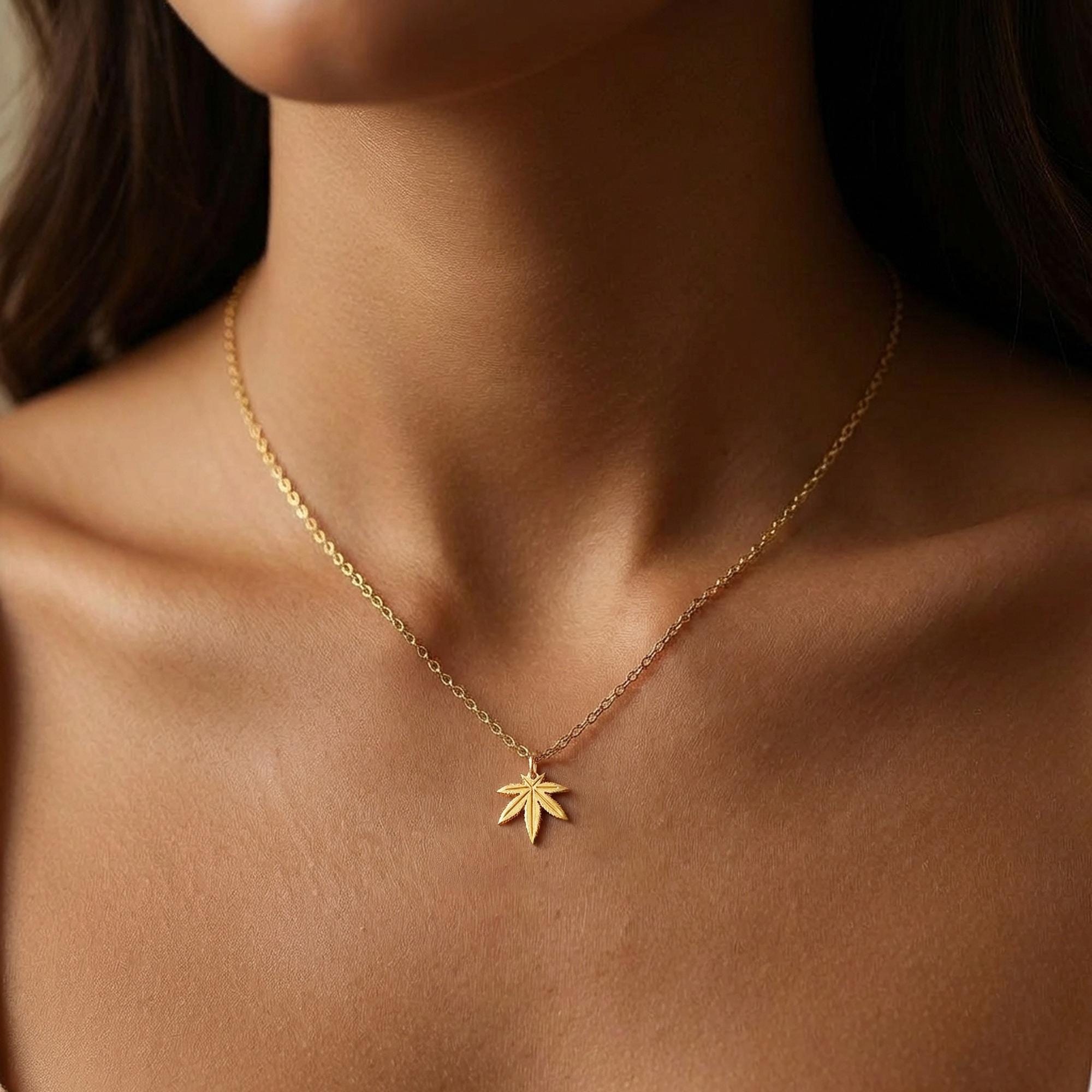 Small gold seven point marijuana leaf pendant on a fine cable chain necklace (2 of 7)