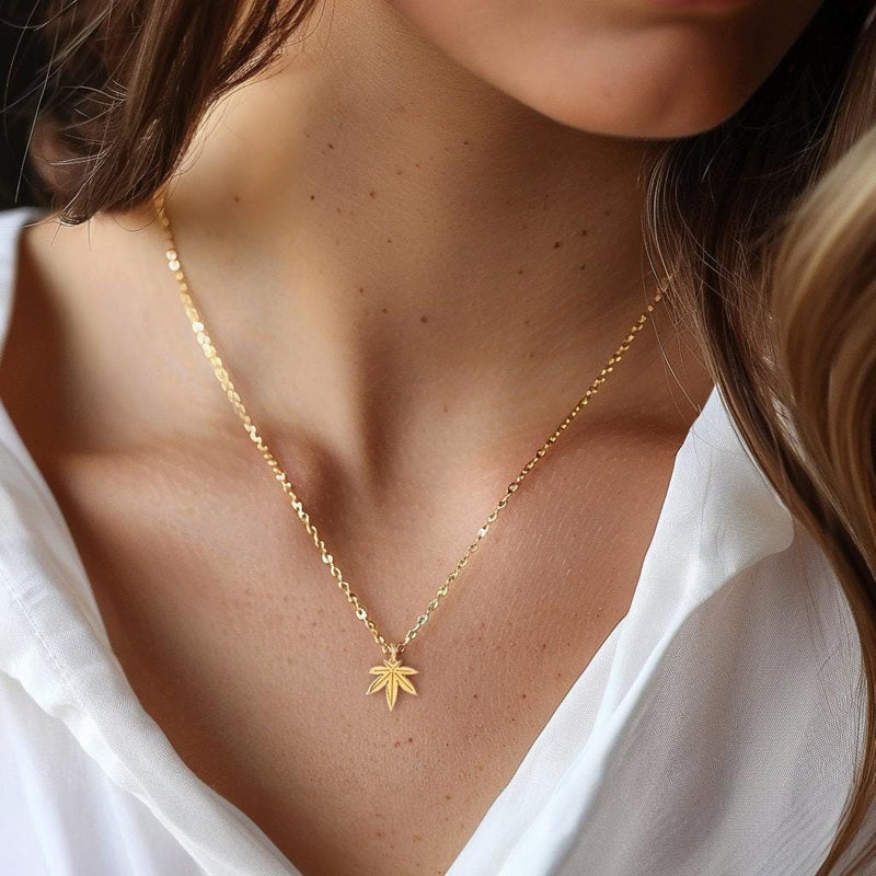 Small gold seven point marijuana leaf pendant on a fine cable chain necklace (6 of 7)