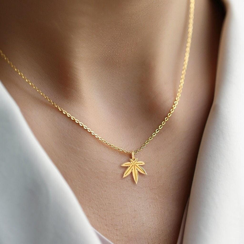 Small gold seven point marijuana leaf pendant on a fine cable chain necklace (7 of 7)