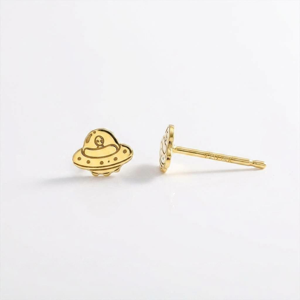 Pair of small alien and flying saucer stud earrings in gold