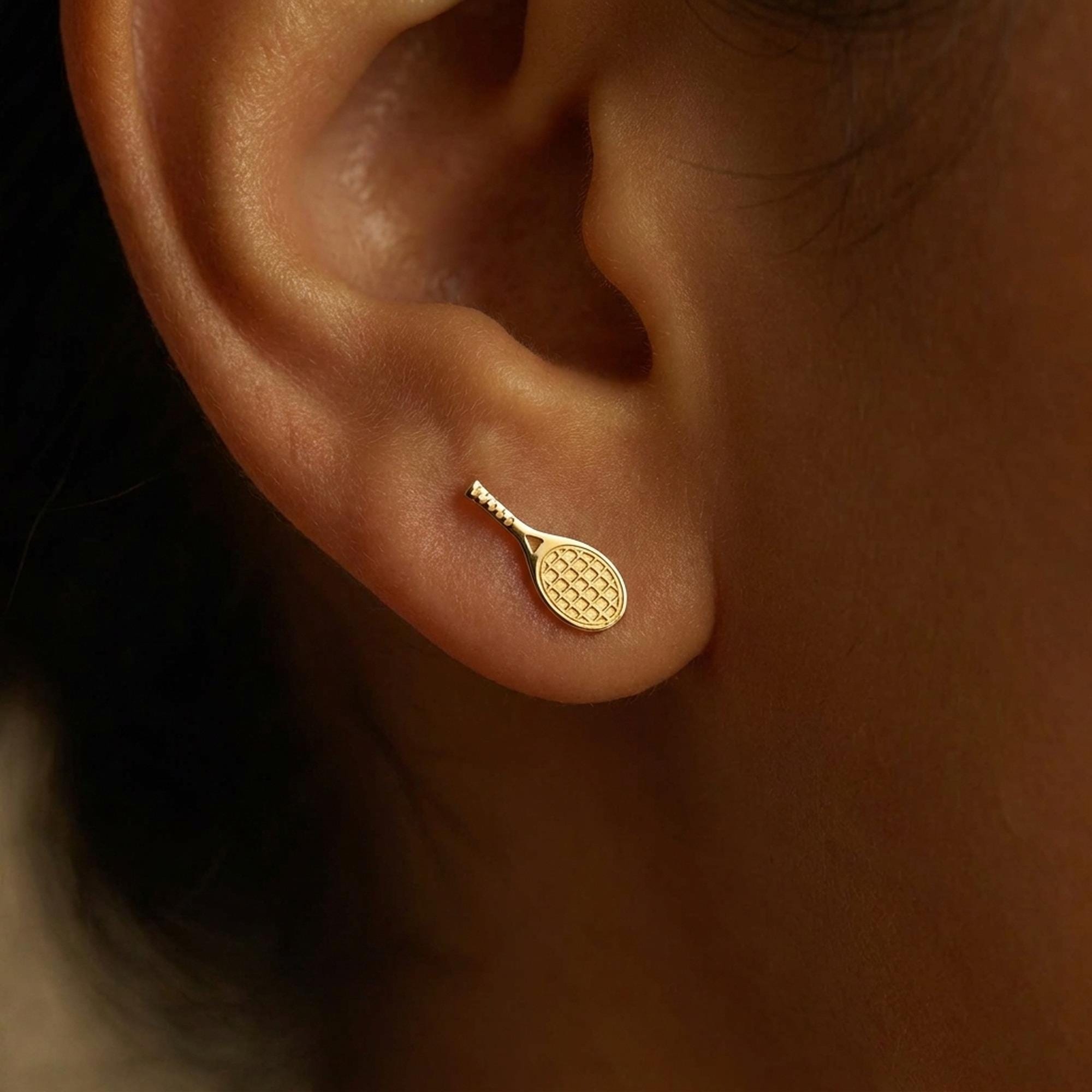 Pair of slim gold tennis racquet stud earrings with strung frames (2 of 14)