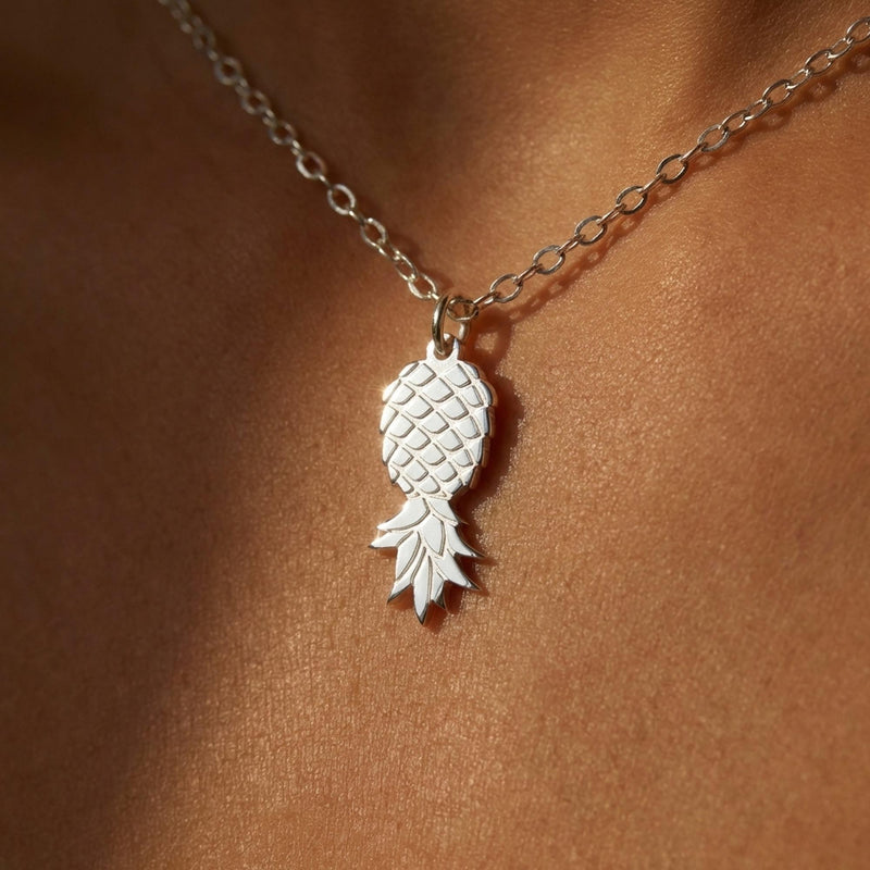Fine gold chain necklace with a small pineapple pendant hanging point down (3 of 9)