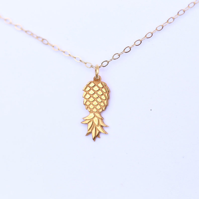 Fine gold chain necklace with a small pineapple pendant hanging point down (5 of 9)