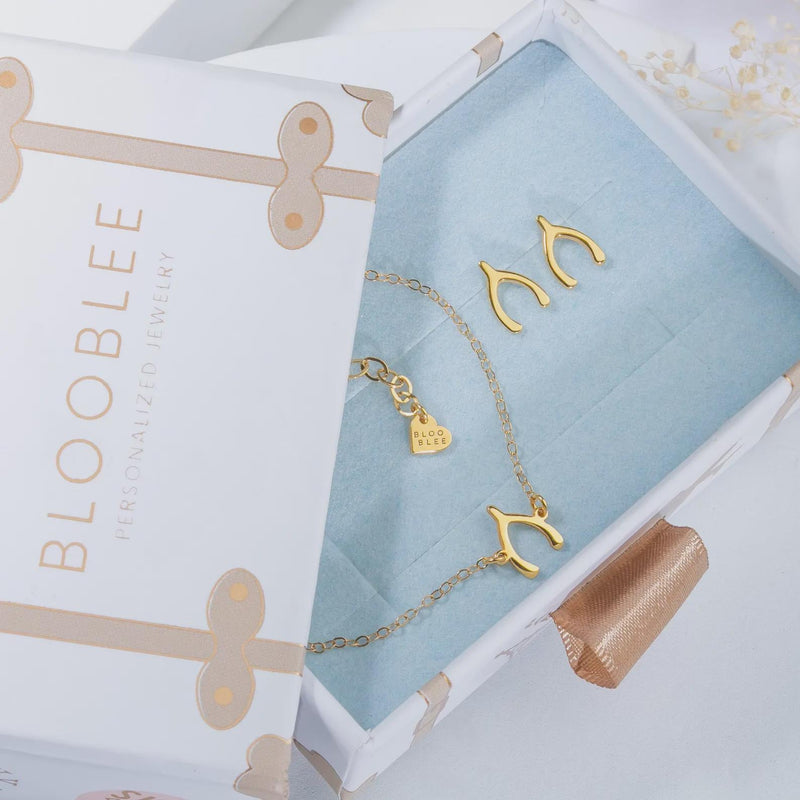 Fine gold chain necklace with a small pineapple pendant hanging point down (9 of 9)