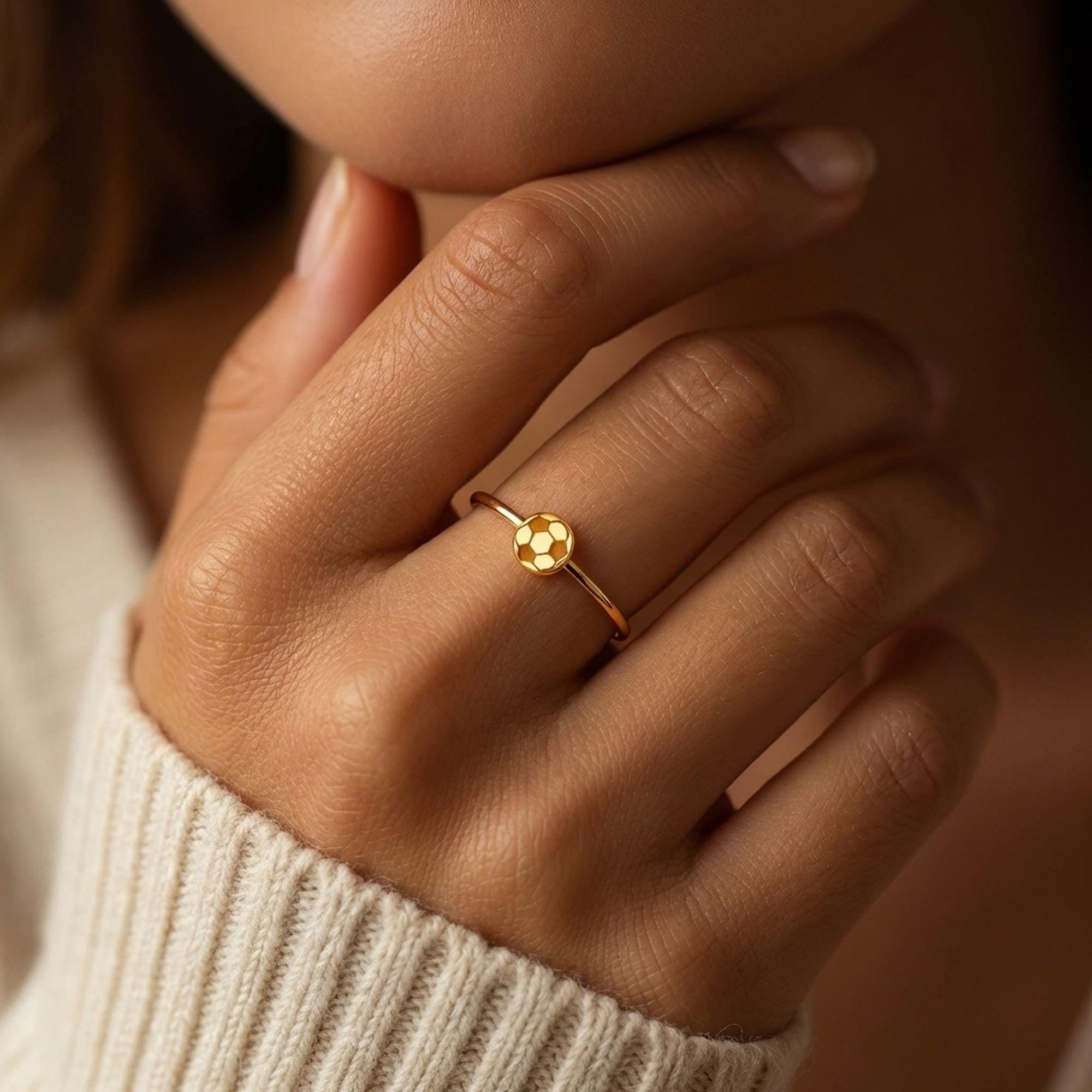 Dainty gold ring with a tiny soccer ball on a slim round band (2 of 10)