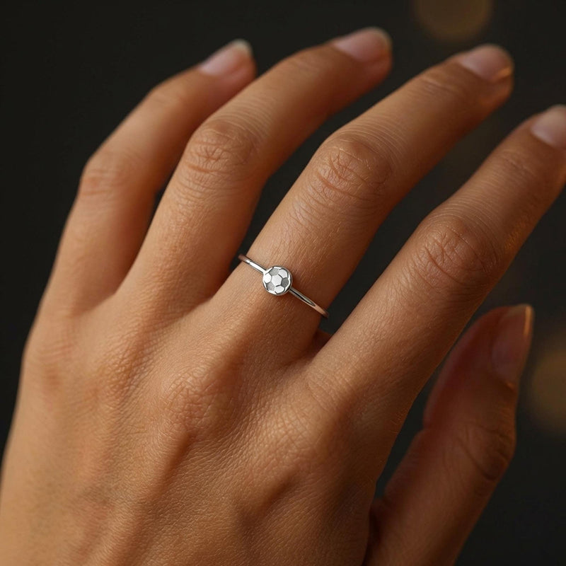Dainty gold ring with a tiny soccer ball on a slim round band (3 of 10)