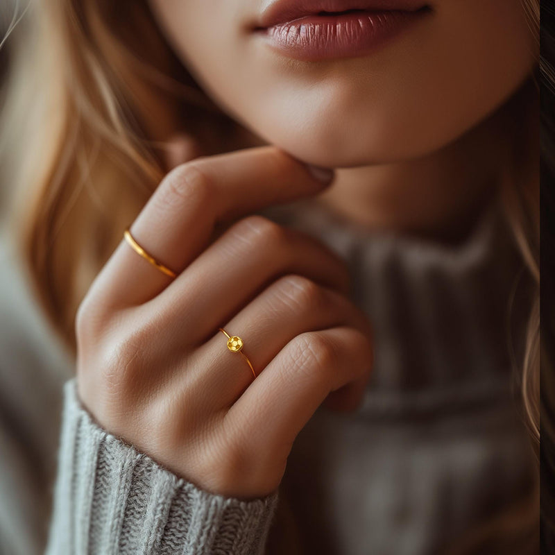 Dainty gold ring with a tiny soccer ball on a slim round band (9 of 10)