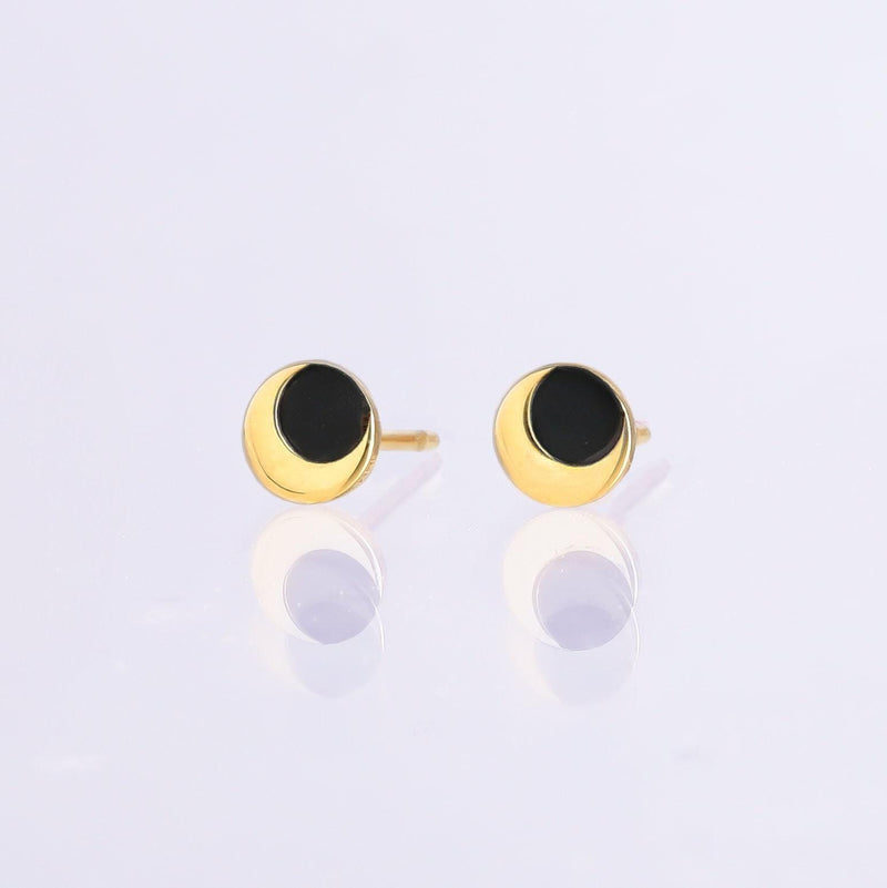 Pair of tiny gold eclipse stud earrings with one disc overlapping another