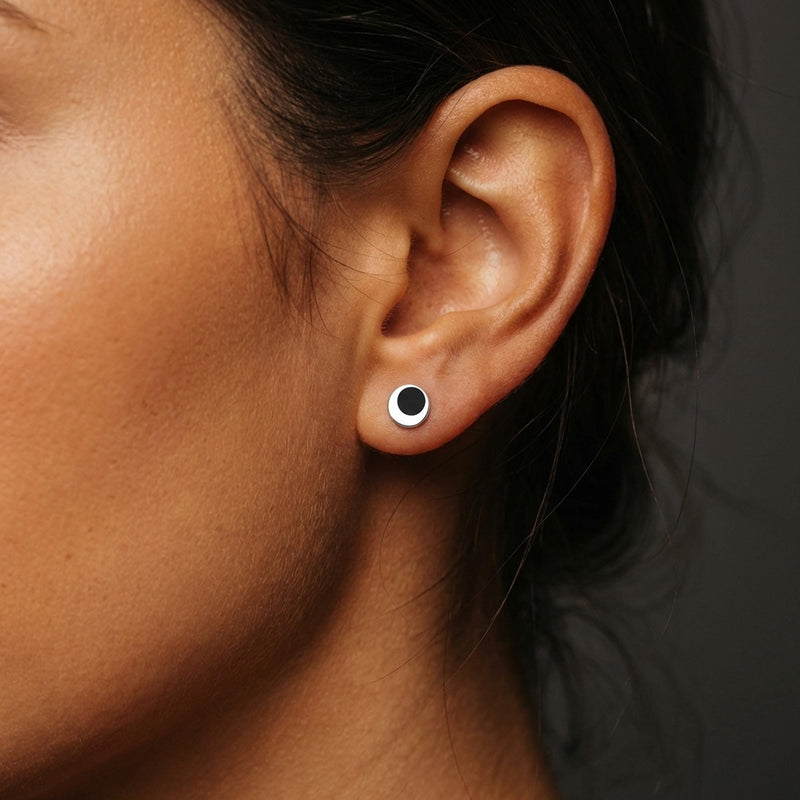 Pair of tiny gold eclipse stud earrings with one disc overlapping another (7 of 7)