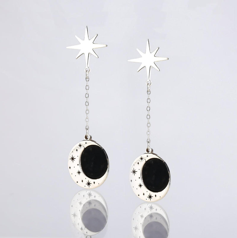 Gold crescent moon earrings with a small star hanging below, shown as a pair (3 of 8)
