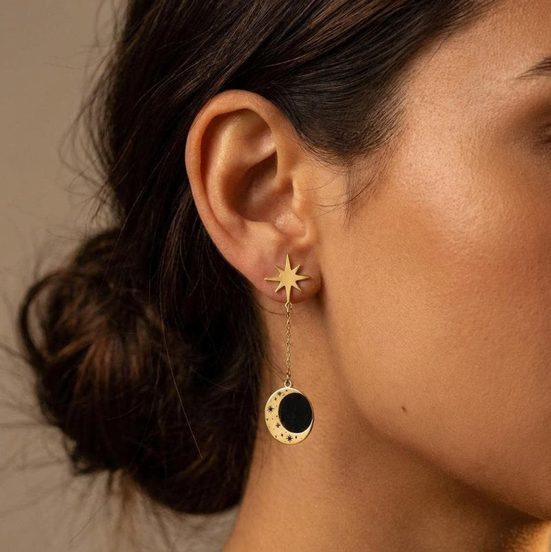Gold crescent moon earrings with a small star hanging below, shown as a pair (4 of 8)