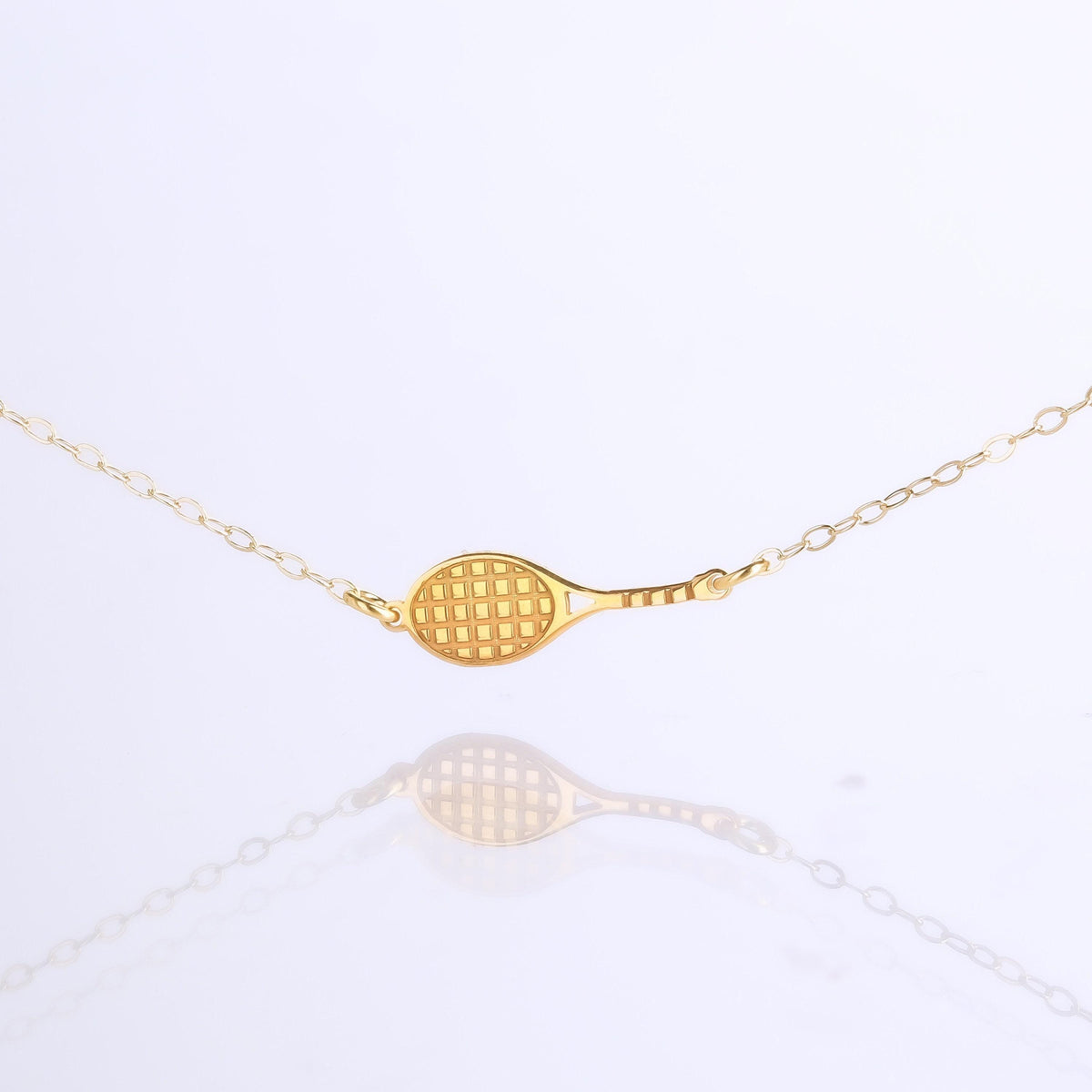 Gold tennis racquet pendant with strung head on a fine chain