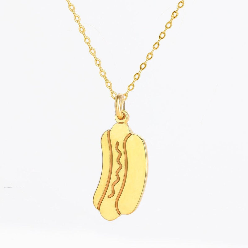 Small gold hotdog pendant with mustard zigzag on a thin cable chain