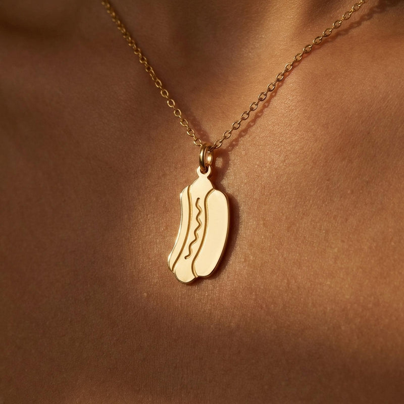 Small gold hotdog pendant with mustard zigzag on a thin cable chain (2 of 9)