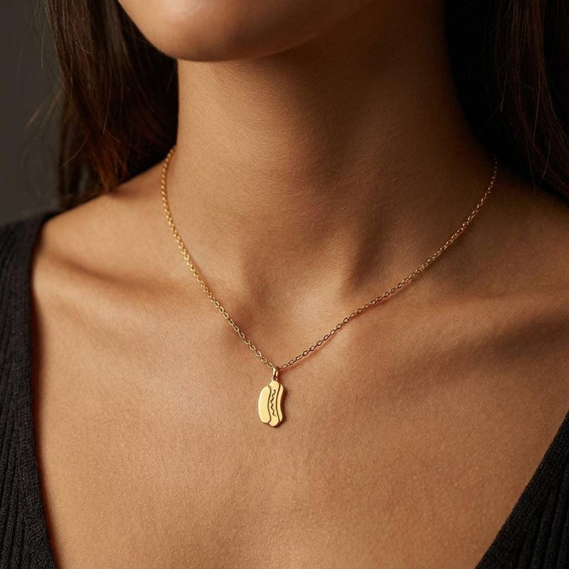 Small gold hotdog pendant with mustard zigzag on a thin cable chain (3 of 9)