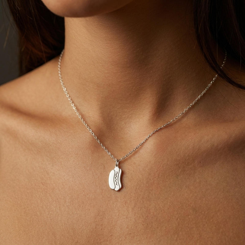 Small gold hotdog pendant with mustard zigzag on a thin cable chain (5 of 9)
