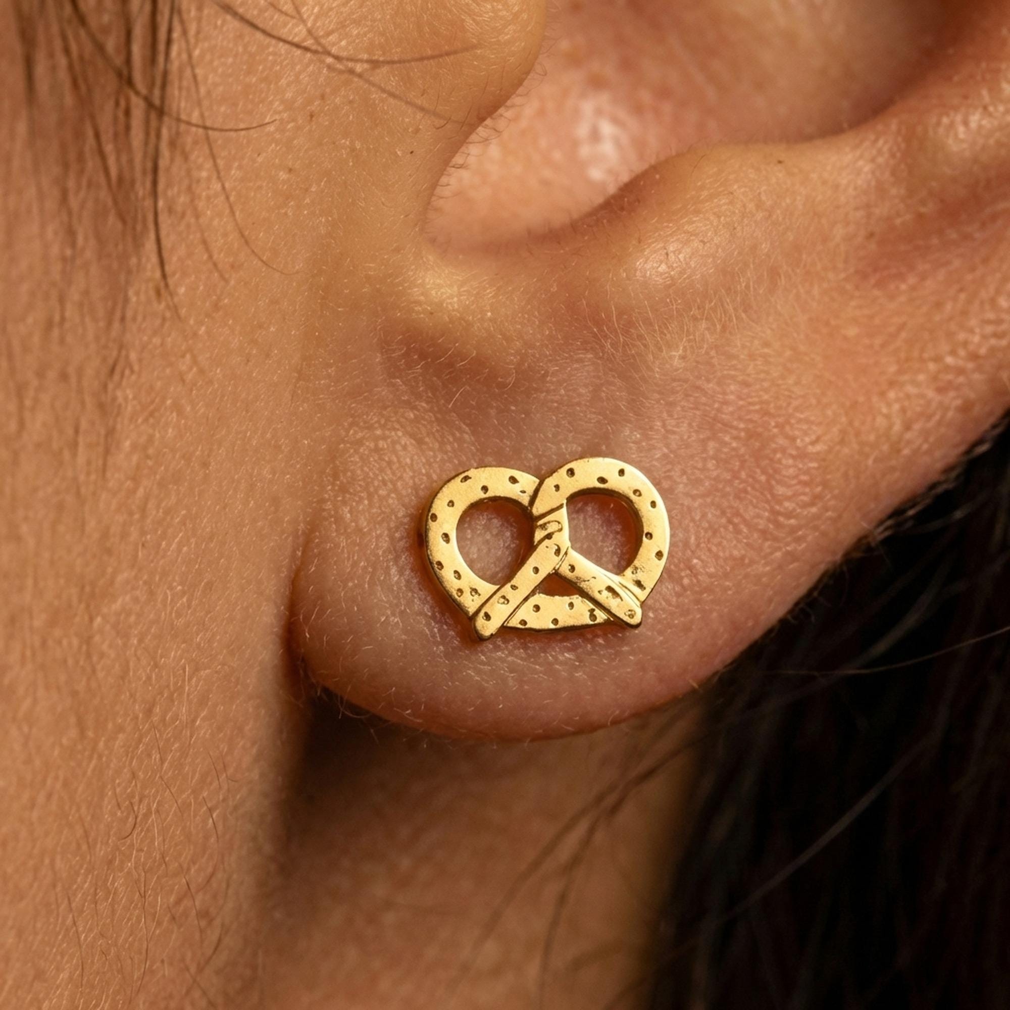 Pair of small gold pretzel stud earrings with three open loops (2 of 10)