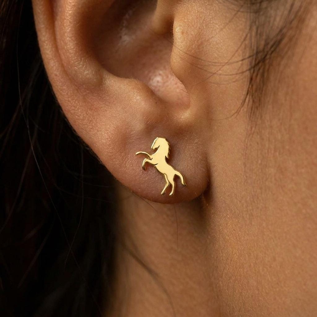 Small gold horse stud earrings, running horse silhouette, shown as a pair (2 of 8)