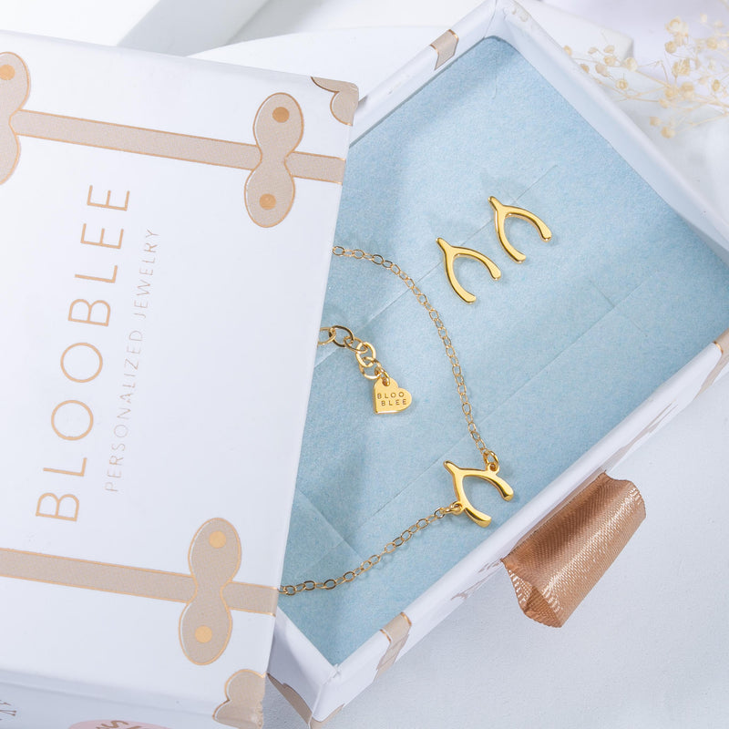 Pair of narrow gold dog bone stud earrings (10 of 11)