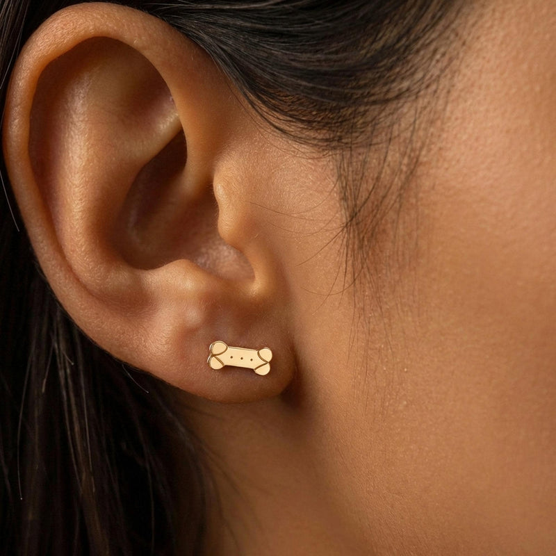 Pair of narrow gold dog bone stud earrings (2 of 11)