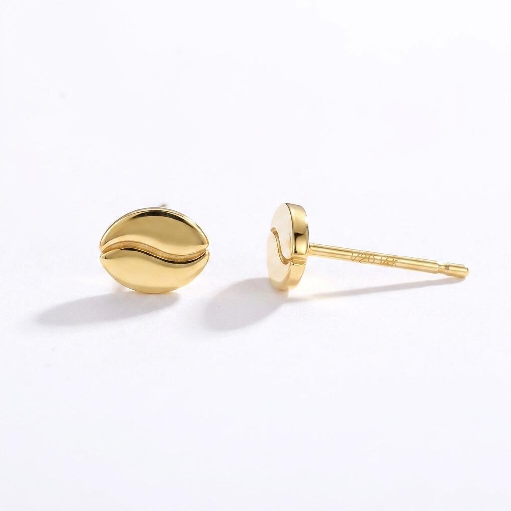Pair of very small coffee bean stud earrings in gold with a center seam
