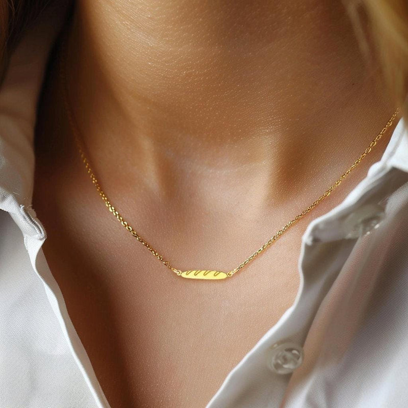 Tiny gold baguette bread pendant with scored top on a fine chain (10 of 11)