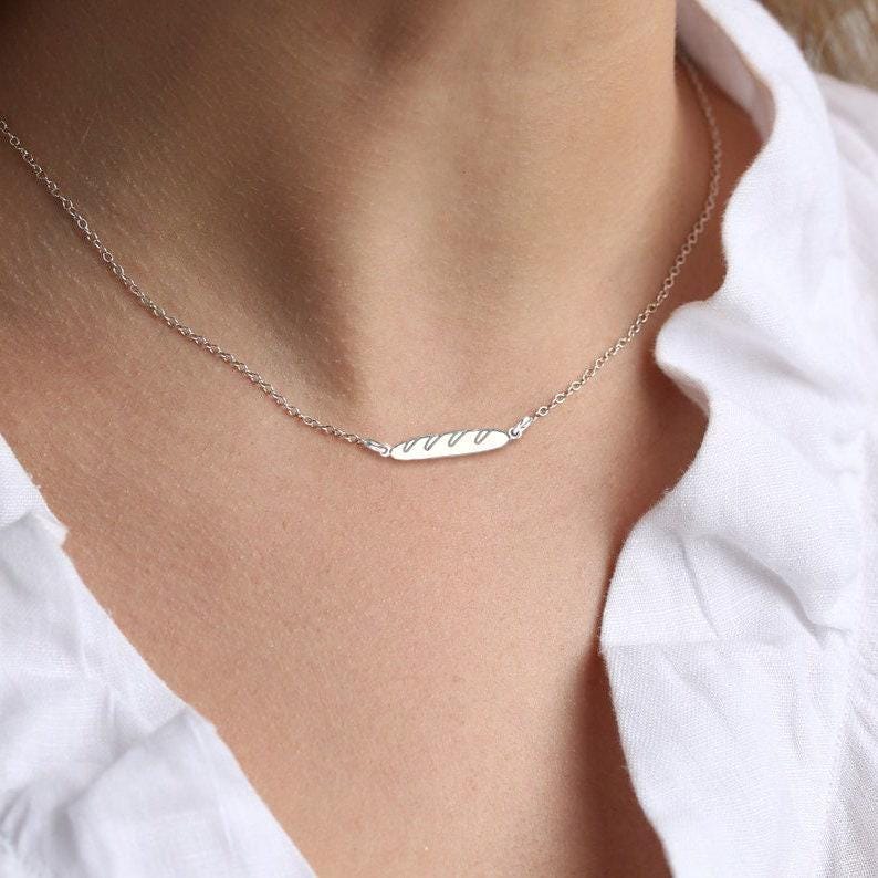 Tiny gold baguette bread pendant with scored top on a fine chain (11 of 11)