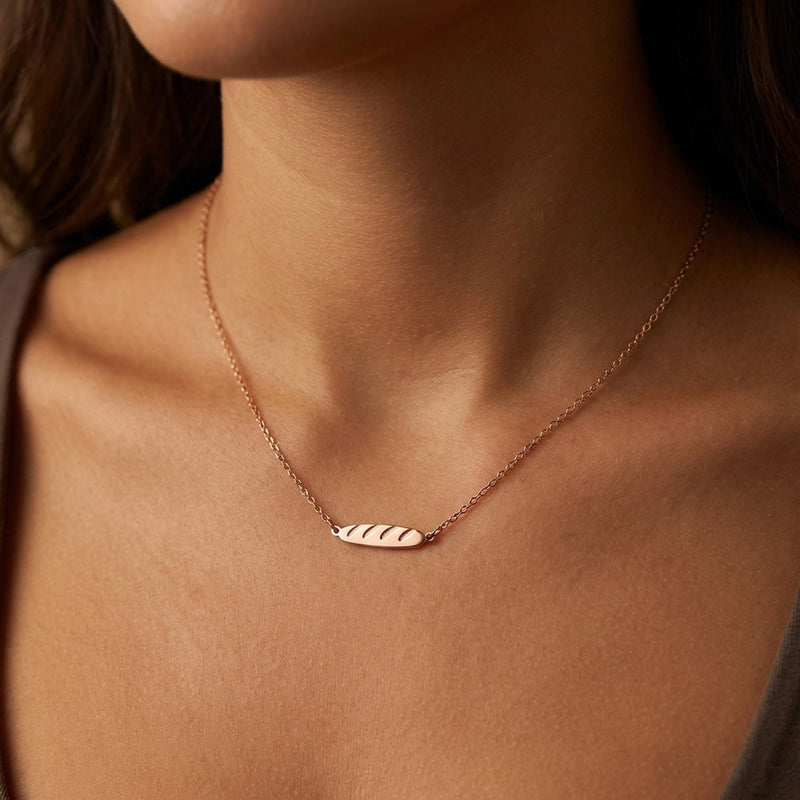 Tiny gold baguette bread pendant with scored top on a fine chain (3 of 11)