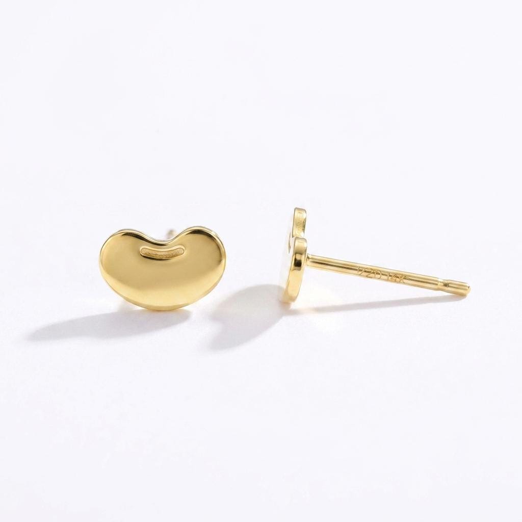 Pair of small kidney bean shaped stud earrings in polished gold