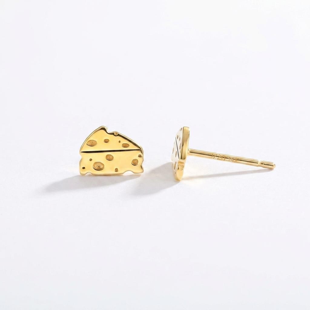 Small gold cheese wedge stud earrings with cutout holes, shown as a pair