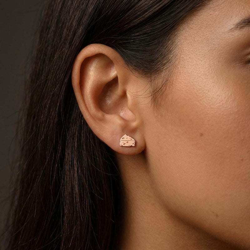 Small gold cheese wedge stud earrings with cutout holes, shown as a pair (6 of 12)