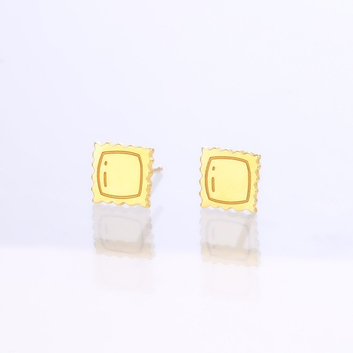 Pair of tiny gold ravioli pasta stud earrings with crimped edges