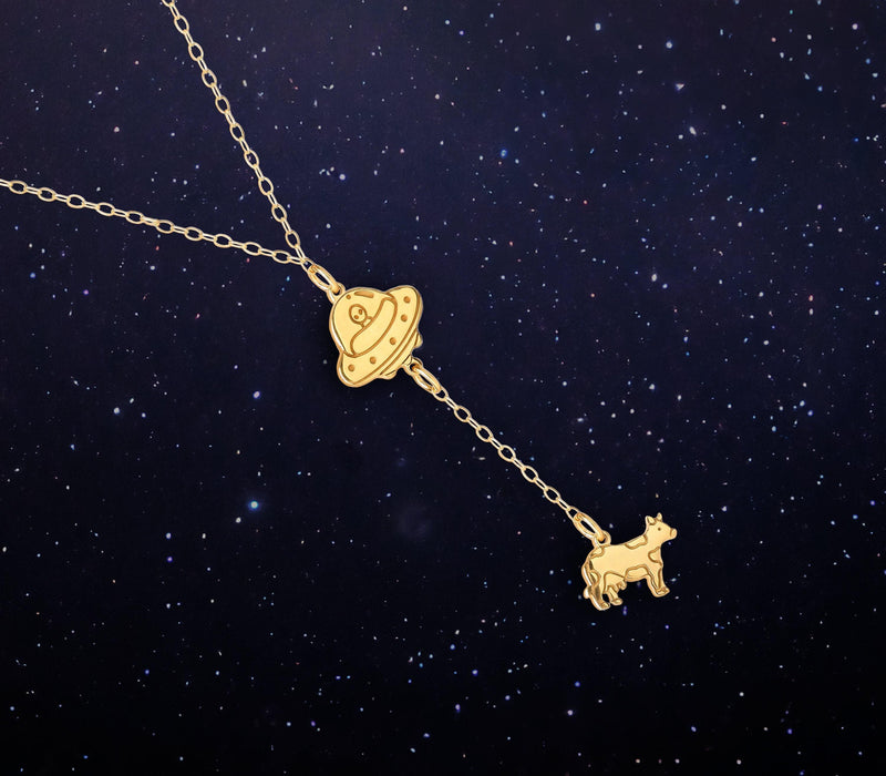 Gold UFO pendant beaming up a tiny cow, hung on a fine cable chain (2 of 10)