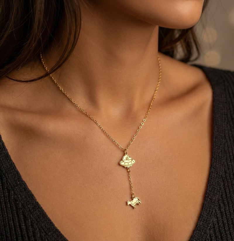 Gold UFO pendant beaming up a tiny cow, hung on a fine cable chain (5 of 10)