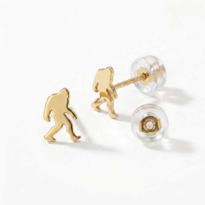 Pair of small gold Bigfoot stud earrings shown mid-stride with posts and backs (3 of 9)