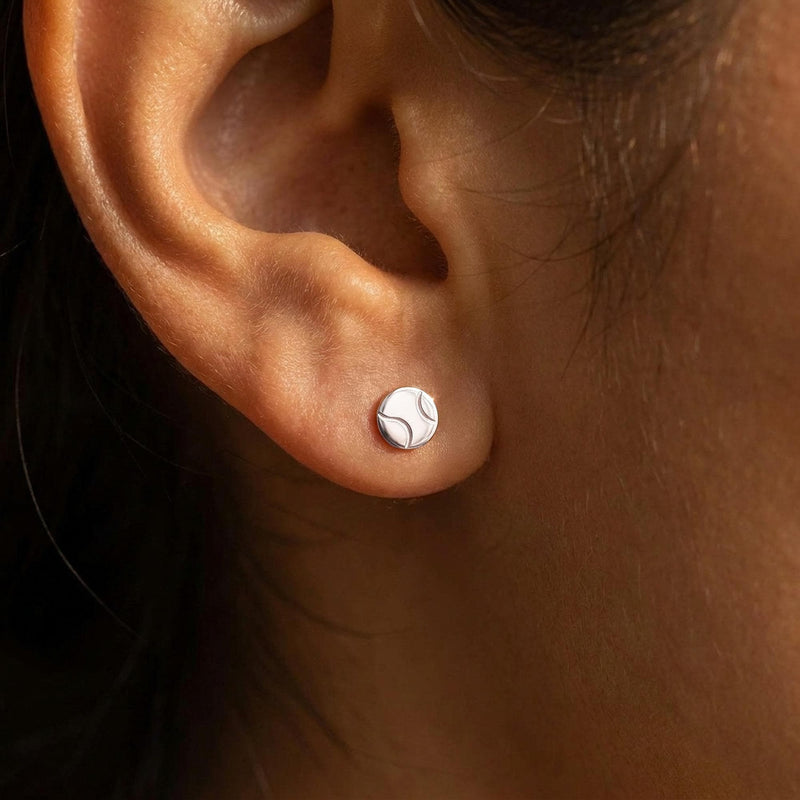Pair of very small round gold tennis ball stud earrings with seam detail (2 of 10)