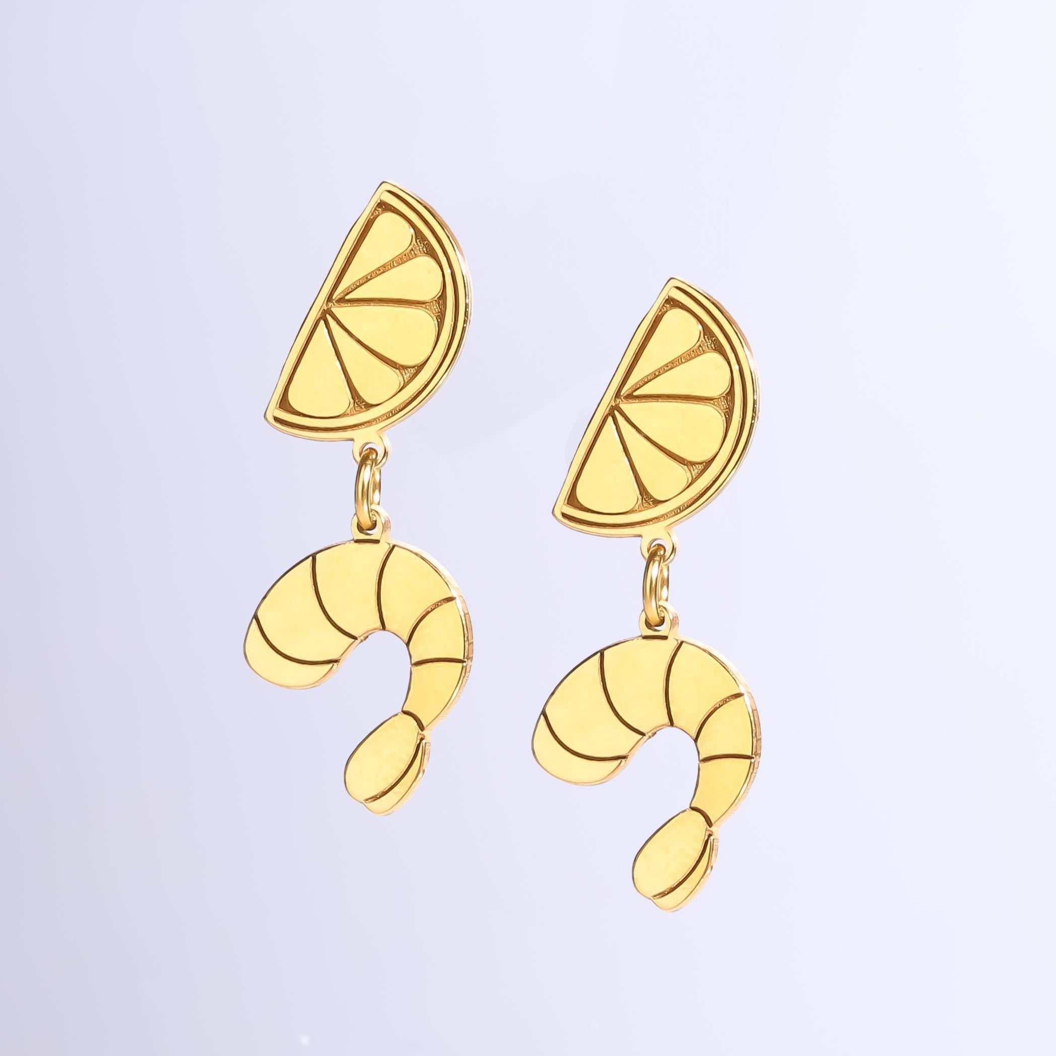 Mismatched gold stud earrings, one lemon and one shrimp, on posts (2 of 5)
