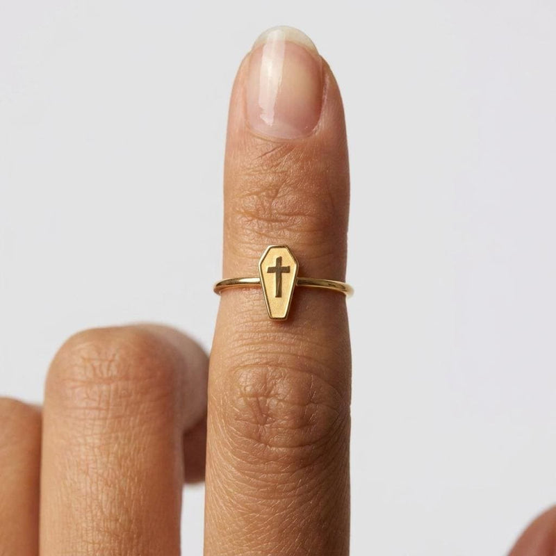 Thin gold stacking ring with a small flat coffin shape on top
