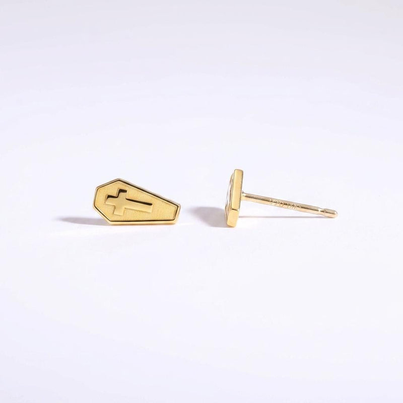 Pair of narrow gold coffin stud earrings with a raised cross on each lid