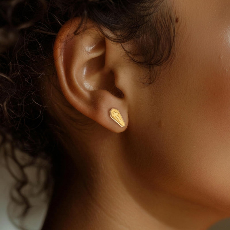Pair of narrow gold coffin stud earrings with a raised cross on each lid (12 of 13)