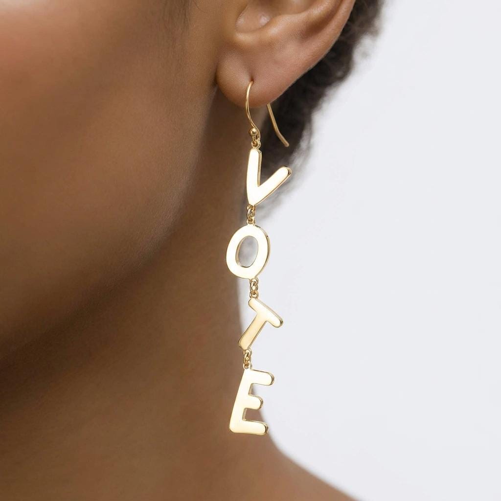 Pair of long gold earrings spelling the word VOTE in cut out letters (2 of 8)