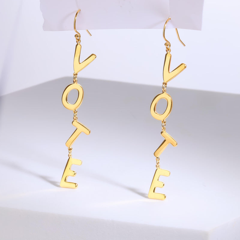 Pair of long gold earrings spelling the word VOTE in cut out letters (8 of 8)