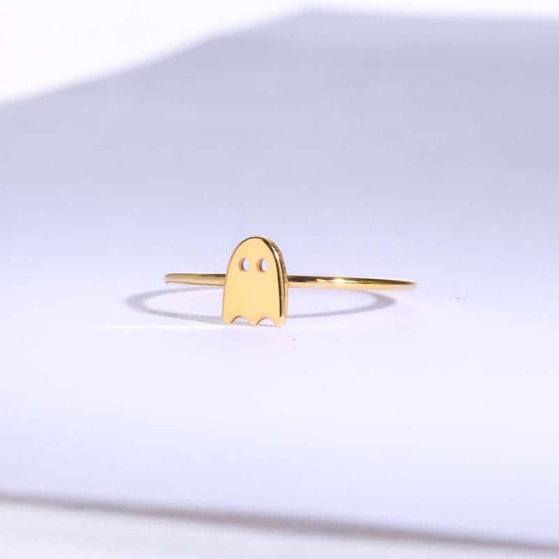 Thin gold stacking ring with a small flat ghost shape on the band (10 of 15)