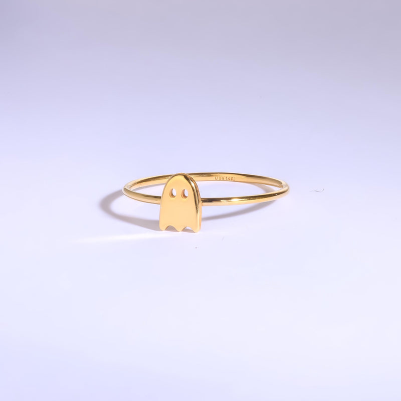Thin gold stacking ring with a small flat ghost shape on the band (9 of 15)
